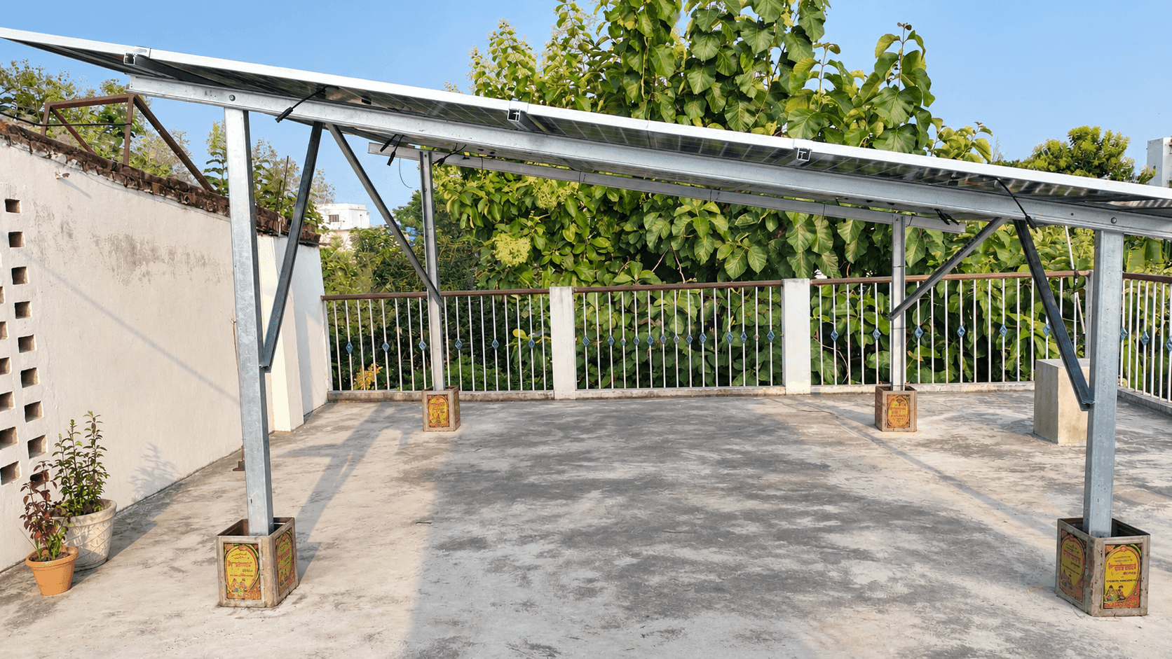 Completed solar array viewed from underneath, showing the rooftop supporting structure.