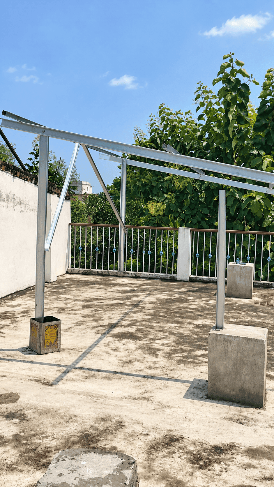Rooftop mounting frame with support posts and cross-bracing before panel installation.
