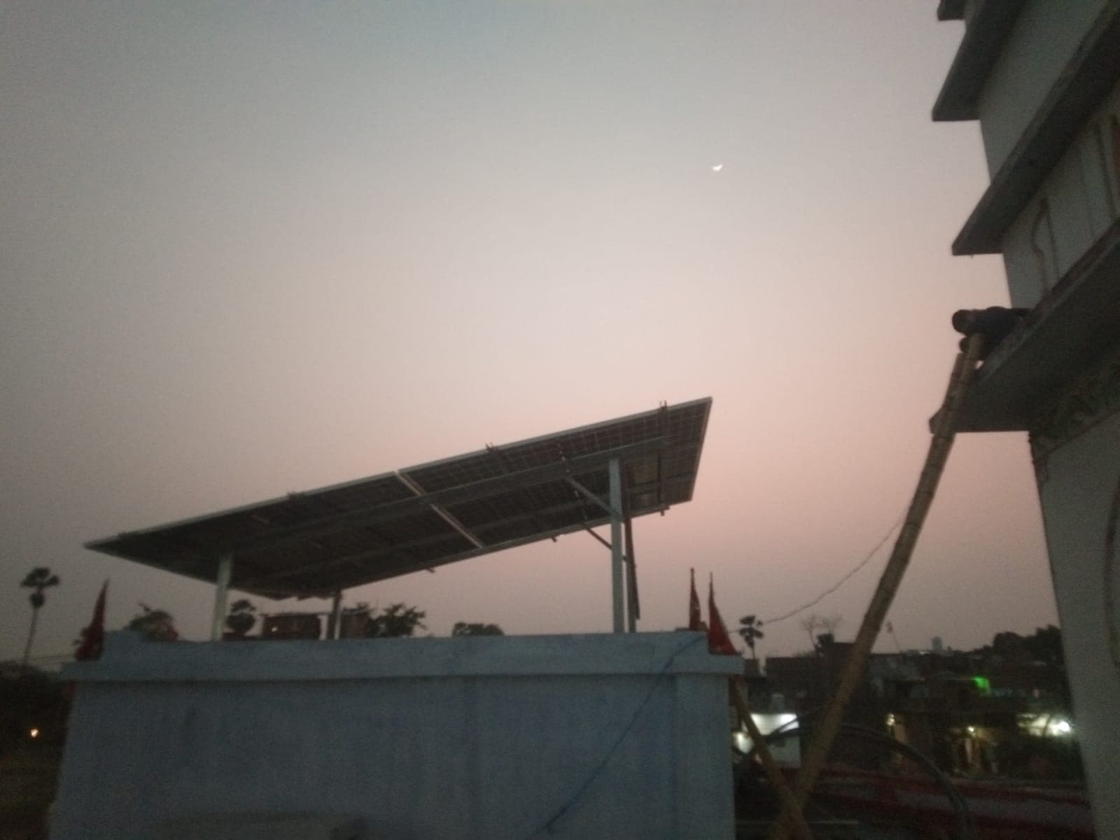 Residential solar panel array viewed at dusk.