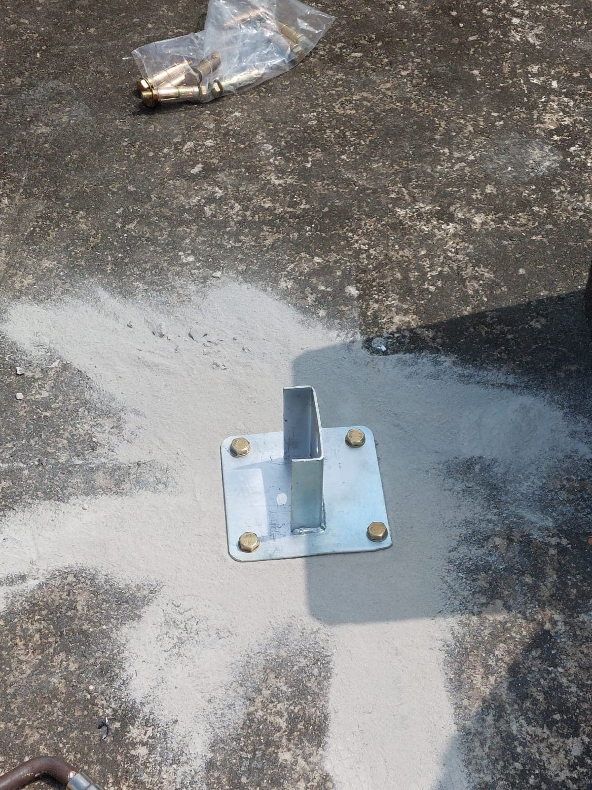 Close view of a secured rooftop mounting base.